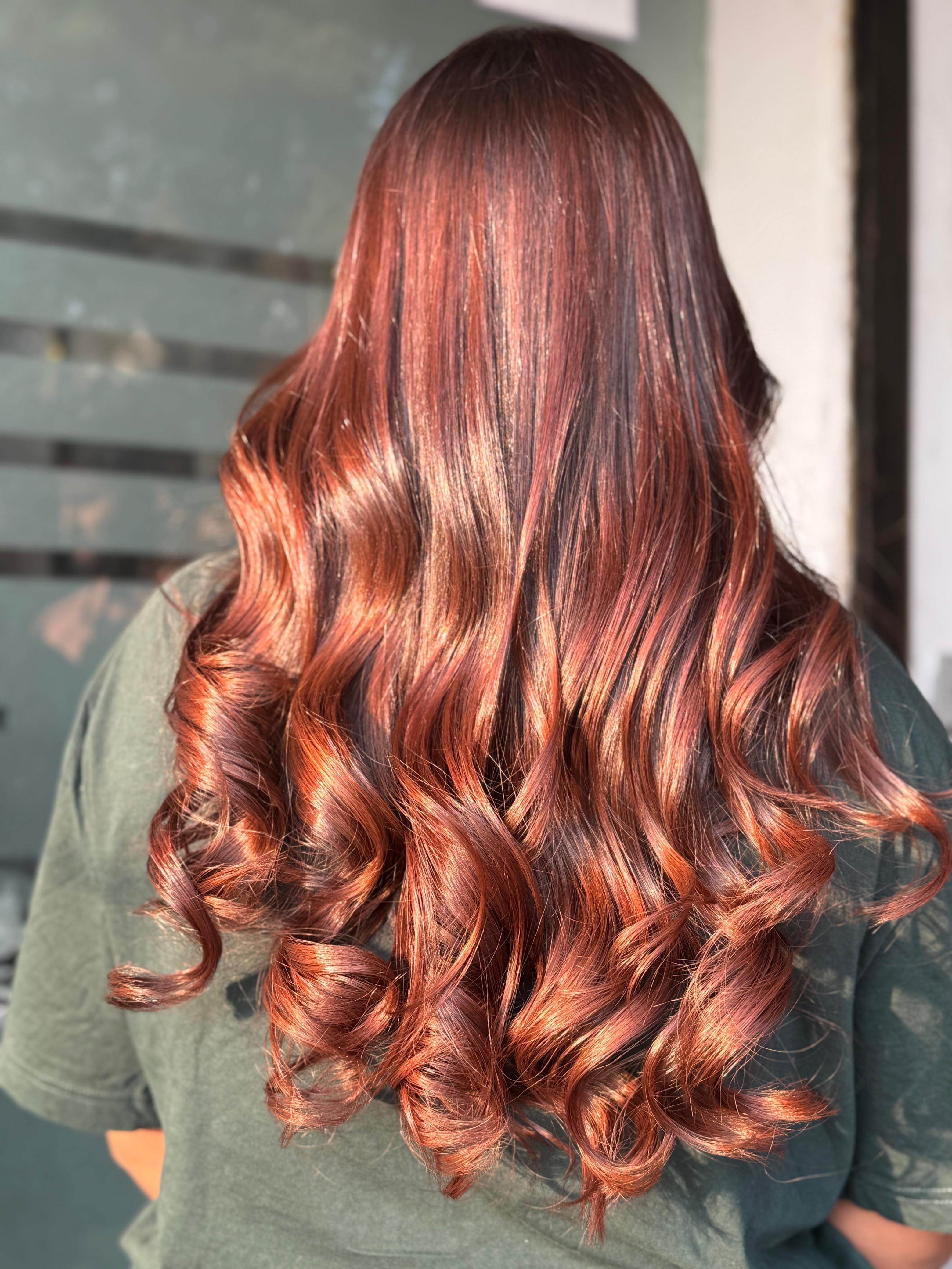 Rich copper-red balayage curls