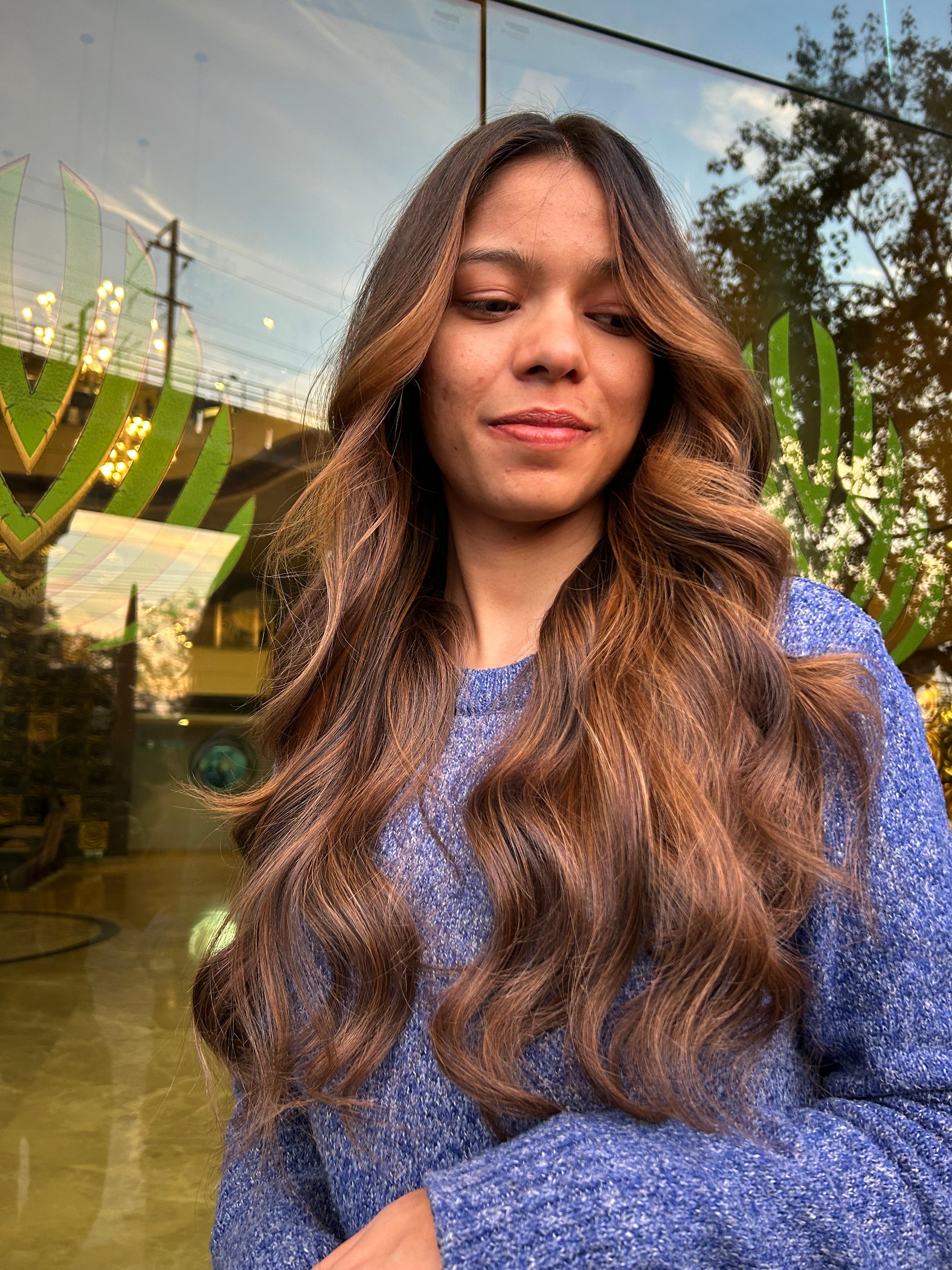 Soft caramel highlights with curls
