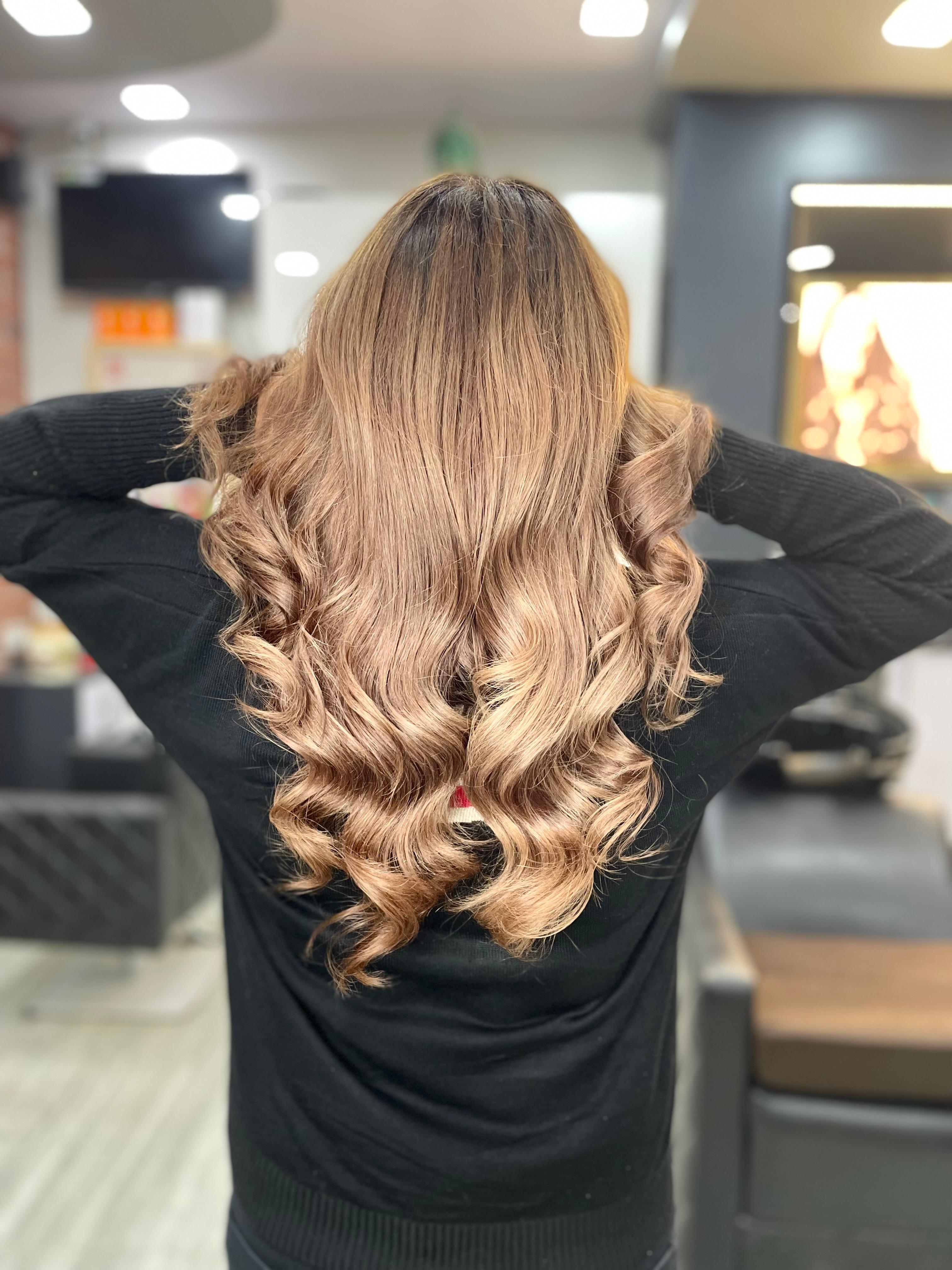 Flowing dark hair with warm balayage